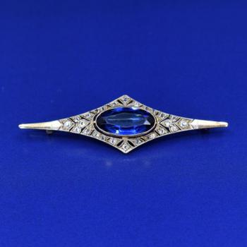 Gold brooch with blue stone and diamonds